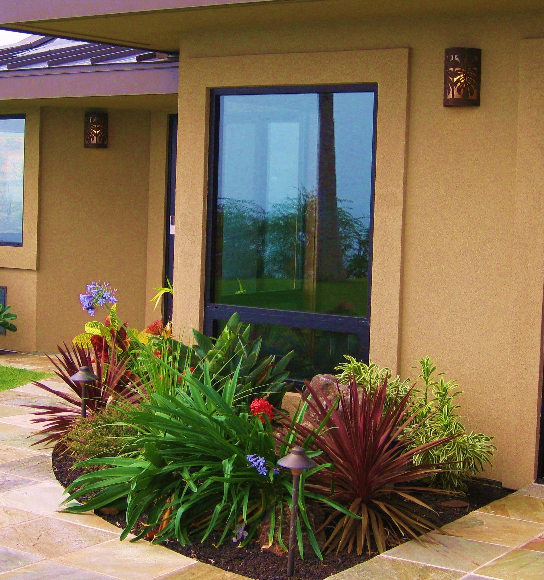 scene of a house featuring the large monstera copper sconces